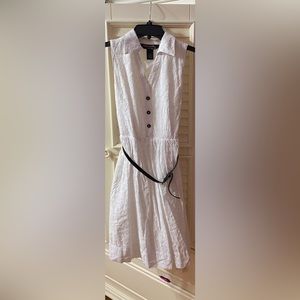 White dress with blacks buttons and waist belt